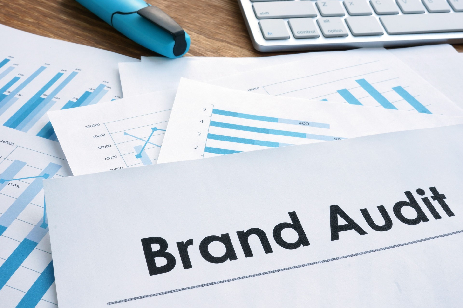Brand audit report, documents and keyboard.